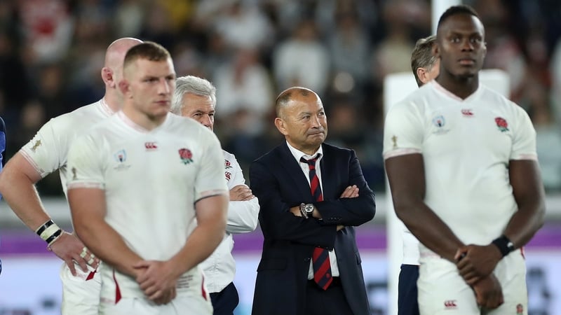 Eddie Jones watches the presentation alongside his players