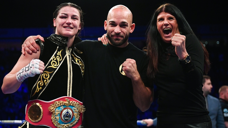 Taylor celebrates with trainer Ross Enamait and her mother Bridget