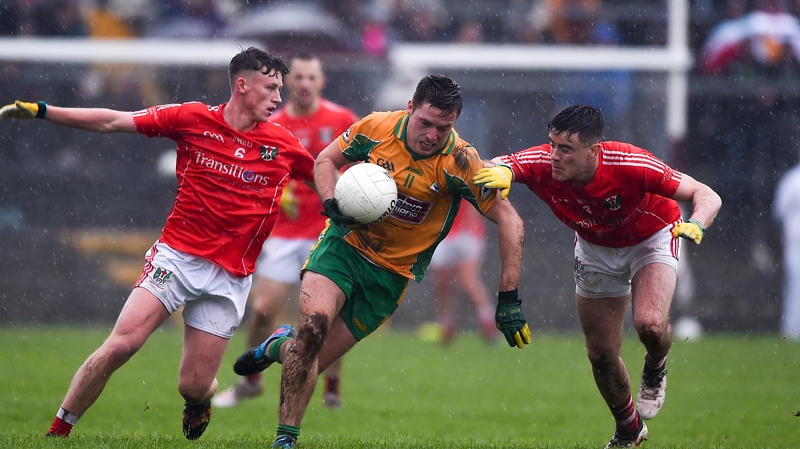 Dylan Wall of Corofin tries to burst past Ben O'Connell, left, and Conor Rhatigan of Tuam Stars
