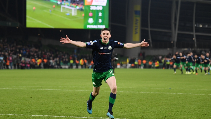 Gary O'Neill of Shamrock Rovers wheels away on celebration after scoring the winning penalty