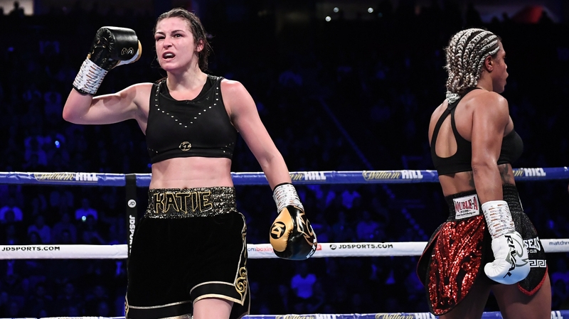 Katie Taylor (L) celebrates at the end of her WBO Super-Lightweight world title fight with Christina Linardatou