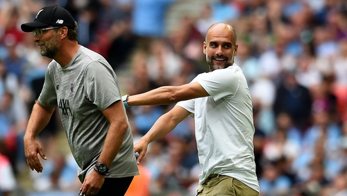 Jurgen Klopp (L) and Pep Guardiola do battle again this Sunday