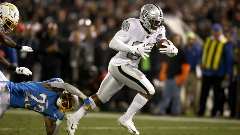 Oakland Raiders' Josh Jacobs breaks free from Rayshawn Jenkins