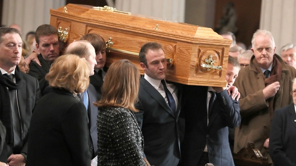 Gay Byrne's coffin is carried into Dublin's Pro Cathedral