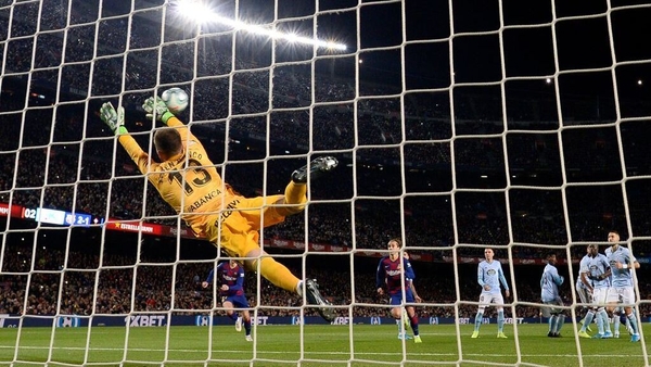 Celta Vigo goalkeeper Ruben Blanco Veiga fails to stop a Leo Messi free-kick