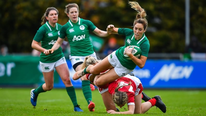 Ireland winger Eimear Considine is tackled by Alecs Donovan, left, and Paige Randall at the UCD Bowl