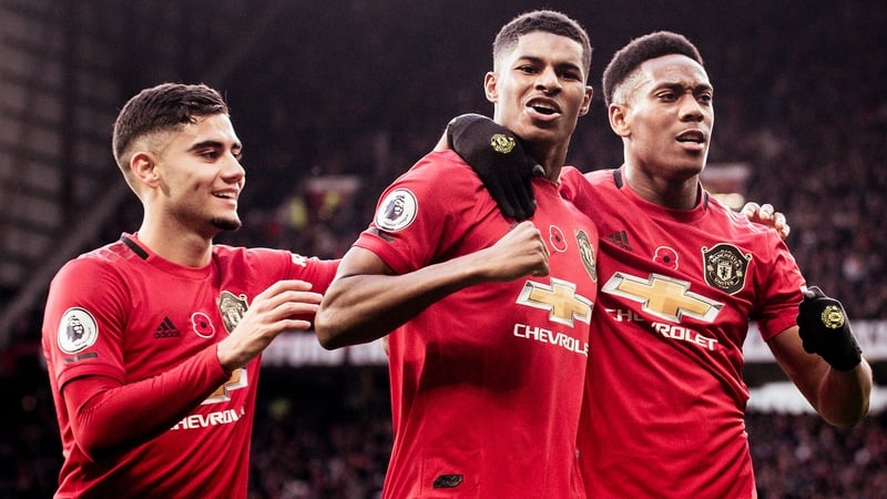 Marcus Rashford celebrates his strike with Andreas Pereira and Anthony Martial