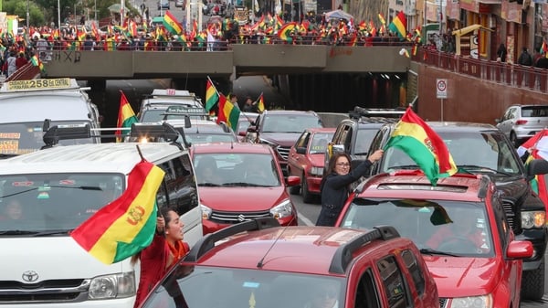 Bolivians celebrate the resignation of President Evo Morales, in La Paz, Bolivia