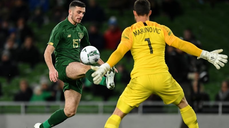 Stefan Marinovic faces down Troy Parrott at the Aviva