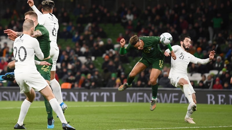 Callum Robinson heads home Ireland's third goal of the night
