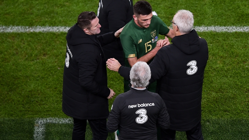 Mick McCarthy (R) and Robbie Keane (L) congratulate Troy Parrott after making his debut