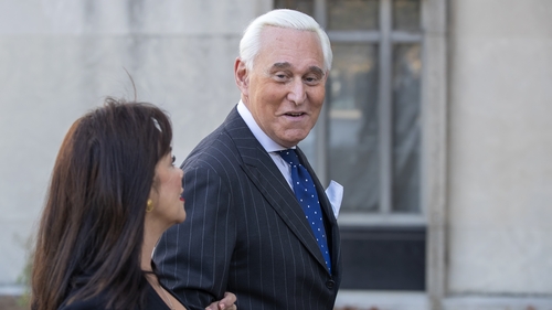 Roger Stone, former adviser to US President Donald Trump, arrives with his wife Nydia to the jury deliberations today