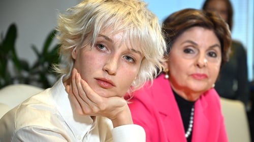 Jane Doe 15 (L) appeared at a news conference with her lawyer Gloria Allred