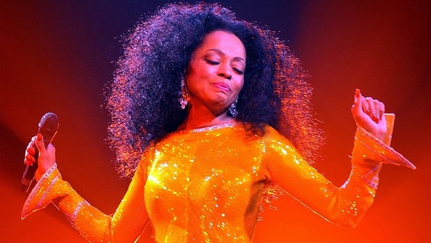 Diana Ross on stage in a glittery dress