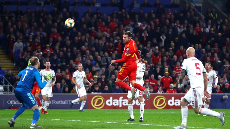Aaron Ramsey heads home his first goal of the night against Hungary