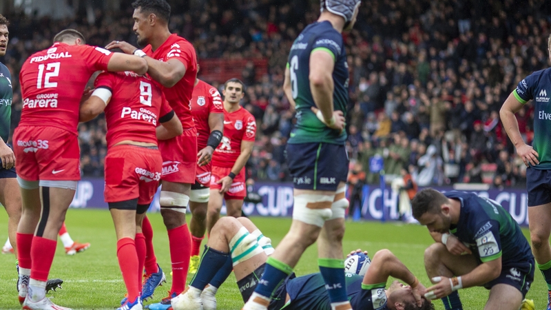 Sebastien Bezy of Stade Toulouse is congratulated by team-mates after scoring a try