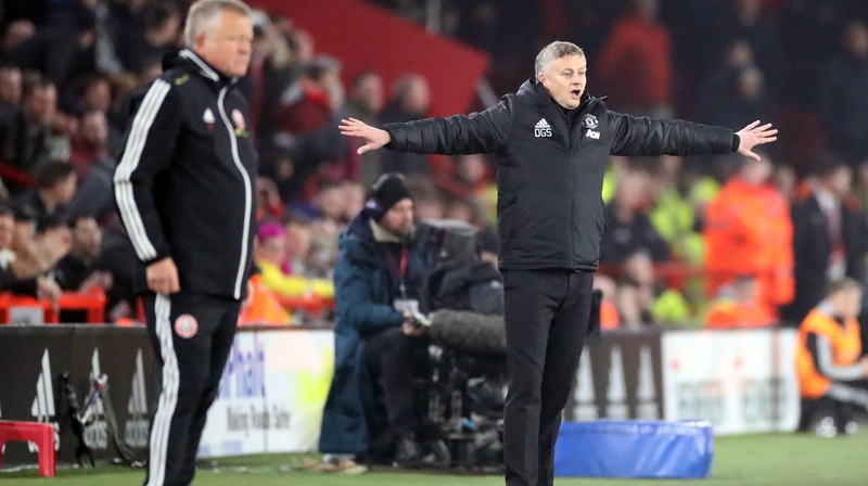 Manchester United manager Ole Gunnar Solskjaer (R) and Sheffield United boss Chris Wilder on the touchline