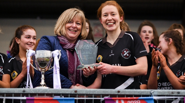 Rena Buckley of Donoughmore receives the Player of the Match award from LGFA President Marie Hickey