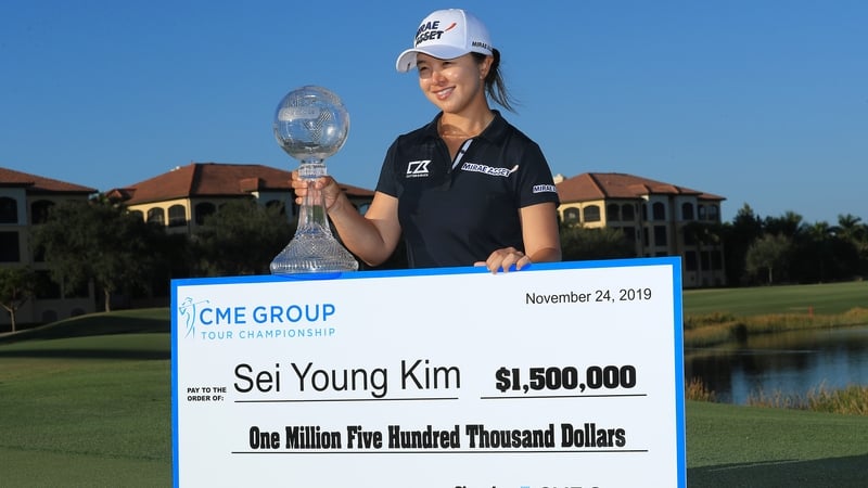 Sei Young Kim celebrates with the trophy and that cheque