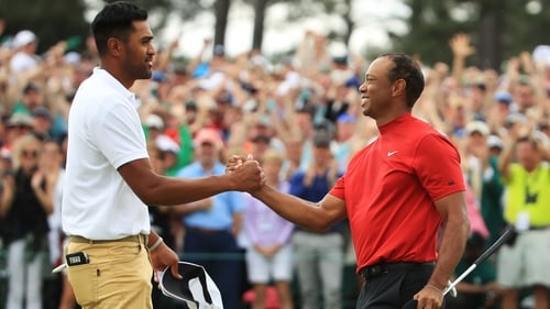Tony Finau (L) with Tiger Woods