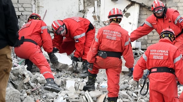 Emergency crews, helped by international rescuers were working through the night to search through the wreckage