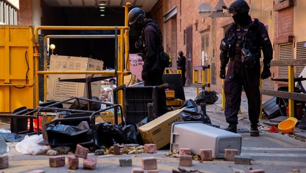 Officers from a bomb disposal unit search the campus of Hong Kong Polytechnic University