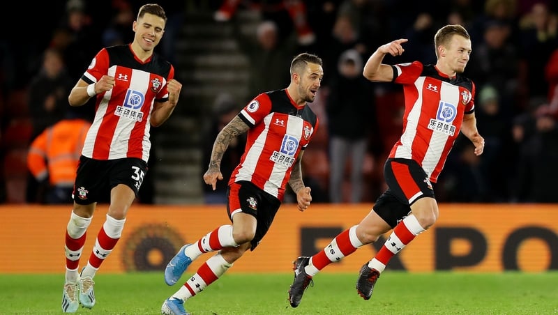 James Ward-Prowse (R) wheels away in celebration after scoring the winner