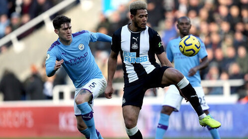 John Stones in action against Newcastle United's Joelinton