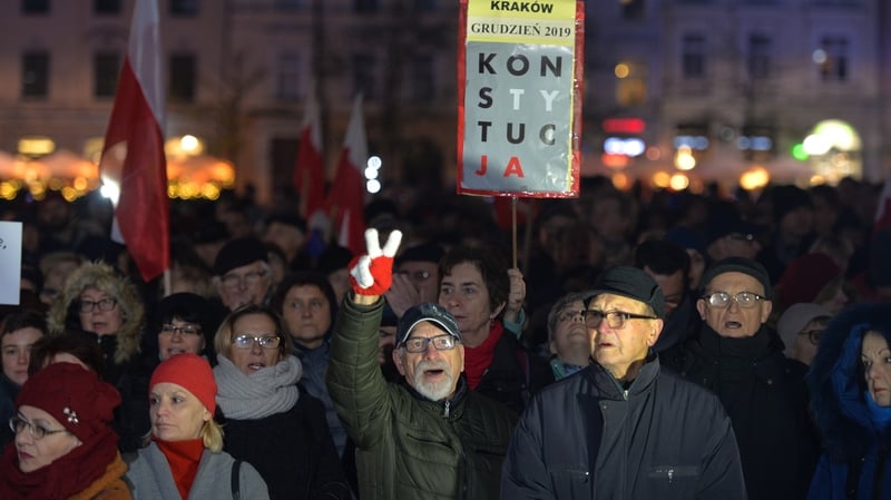 Demonstrators in the capital carried EU flags and signs saying "honour and glory to unbreakable judges"