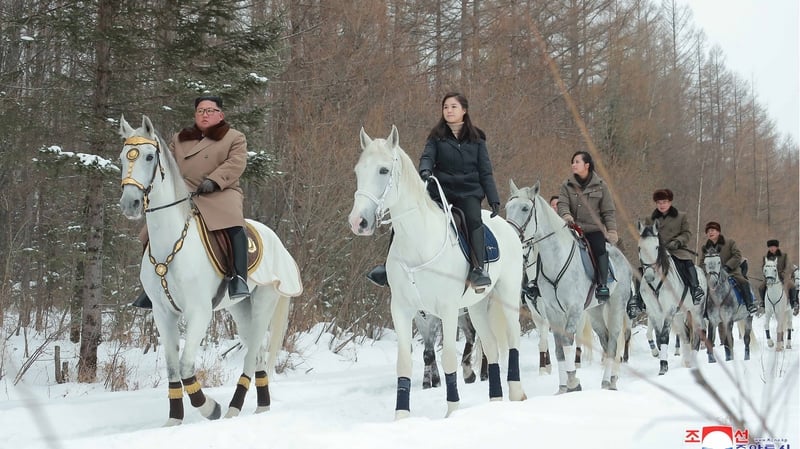 Kim Jong Un was pictured leading a squad of riders in a white forest near Mount Paektu