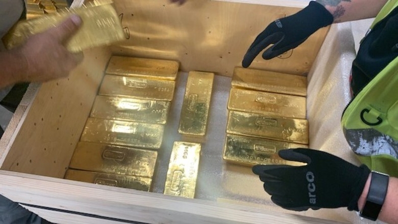 The 12.5kg gold bars were placed in wooden crates and loaded into security trucks (Pic: G4S)