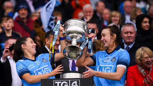 Siobhán Woods, left, and Lucy Collins of Dublin lift the Brendan Martin Cup