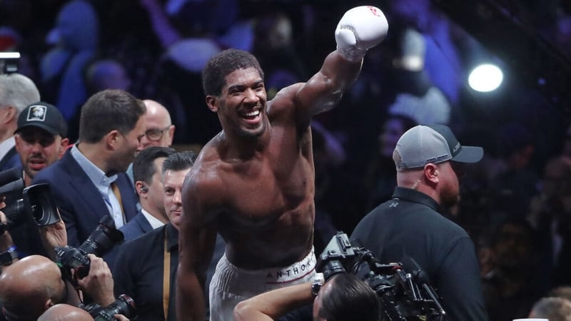 Anthony Joshua celebrates victory