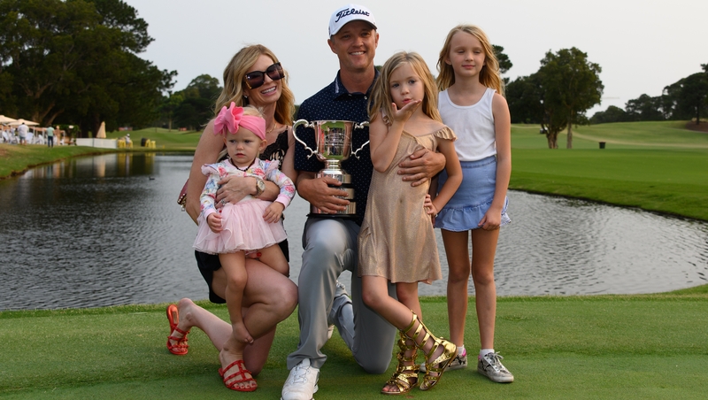 Matt Jones celebrates with his family and the trophy following the win