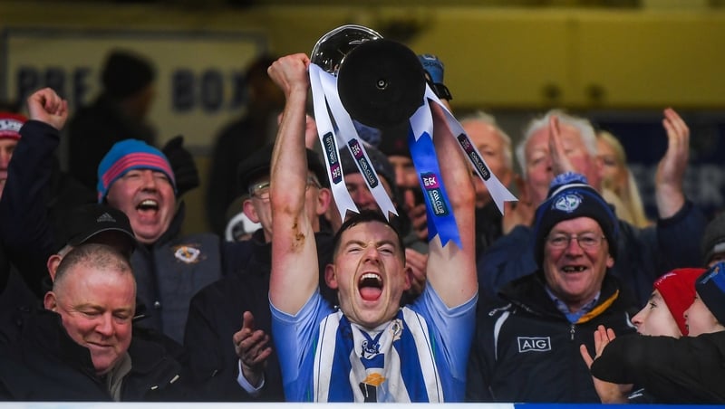 Ryan Basquel lifts the trophy