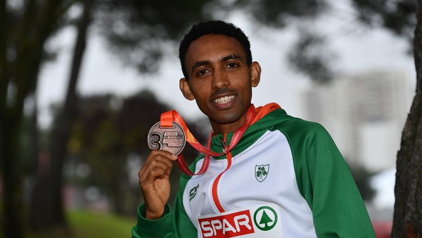 Gidey poses with his bronze medal in Lisbon