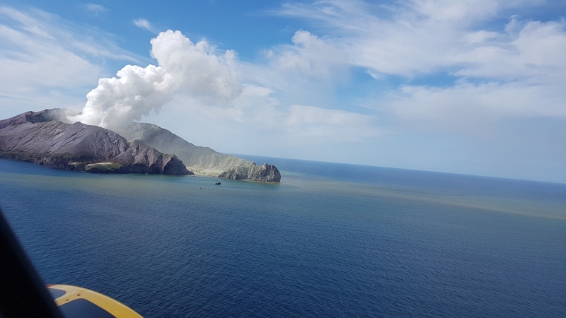 An undated handout photo made available by the Auckland Rescue Helicopter Trust shows the White Island volcano erupting