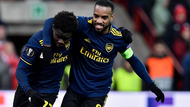 Arsenal goalscorers Baukayo Saka and Alexandre Lacazette celebrates in Frankfurt