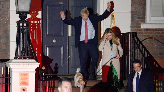 Boris Johnson, whose party hit the magic number of 326 seats at around 5am, celebrates at Conservative Party HQ
