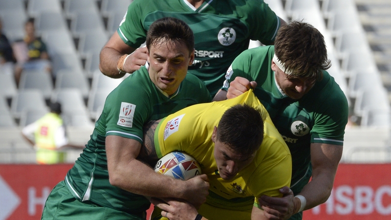 Australia's Sean McMahon is tackled by Ireland's Billy Dardis (L)
