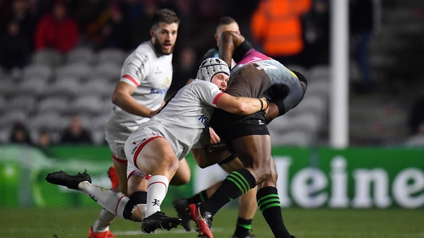 Vereniki Goneva of Harlequins is tackled by Luke Marshall of Ulster