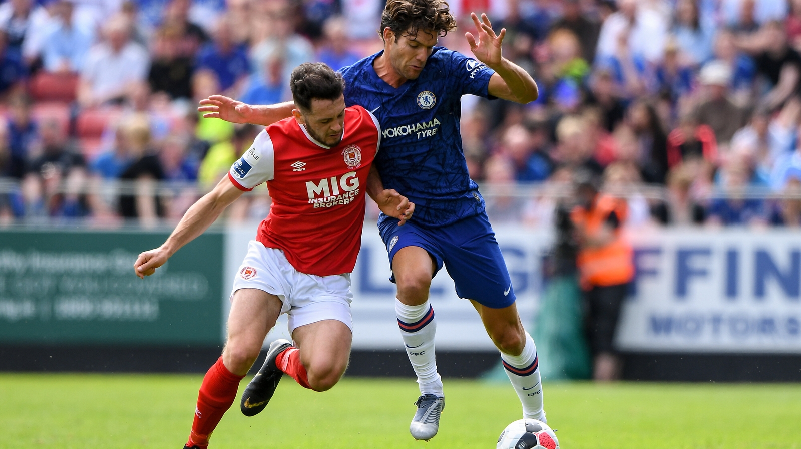 Eric Molloy fends off Chelsea's Marcos Alonso during pre-season this year
