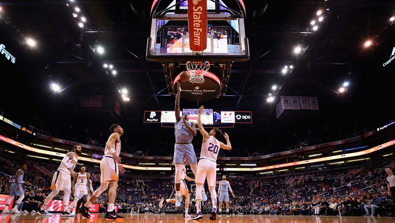 Memphis Grizzlies' Jaren Jackson Jr. (13) attempts a shot over Dario Saric (20) of the Phoenix Suns