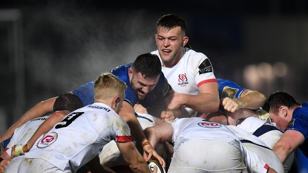 Josh Murphy of Leinster reaches for the ball ahead of David O'Connor of Ulster during