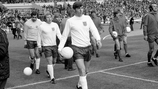 Martin Peters leads out the England team in 1971