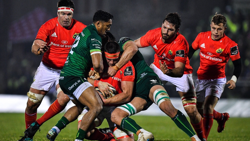 CJ Stander of Munster is tackled by Bundee Aki