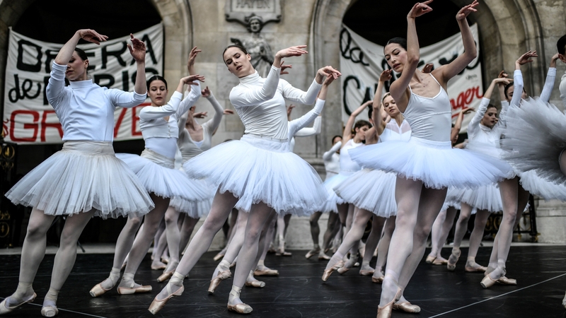 Paris Opera dancers perform in front of the Palais Garnier against the French government's plan to overhaul the country's retirement system