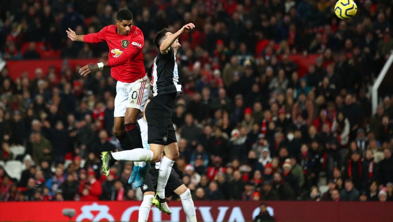 Marcus Rashford leaps highest to score Manchester United's third goal at Old Trafford