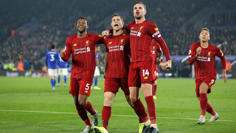 James Milner celebrates his penalty with Liverpool team-mates