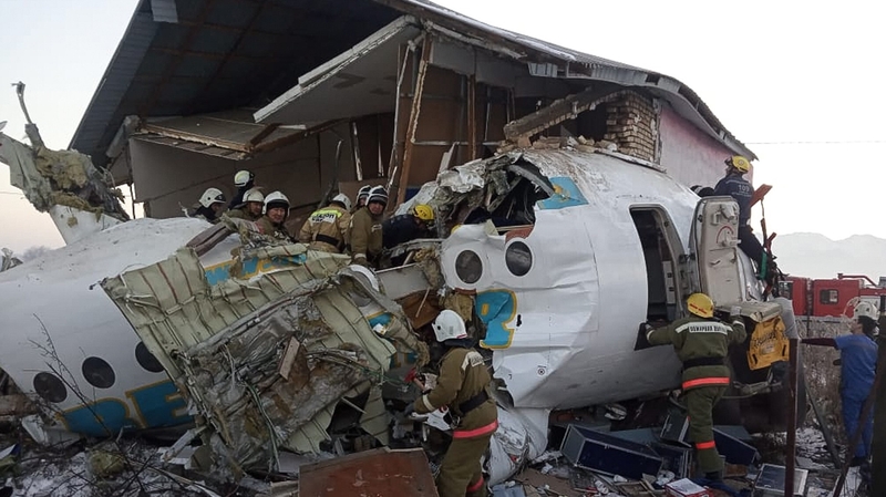 Rescuers at the site of the airplane crash near Almaty airport